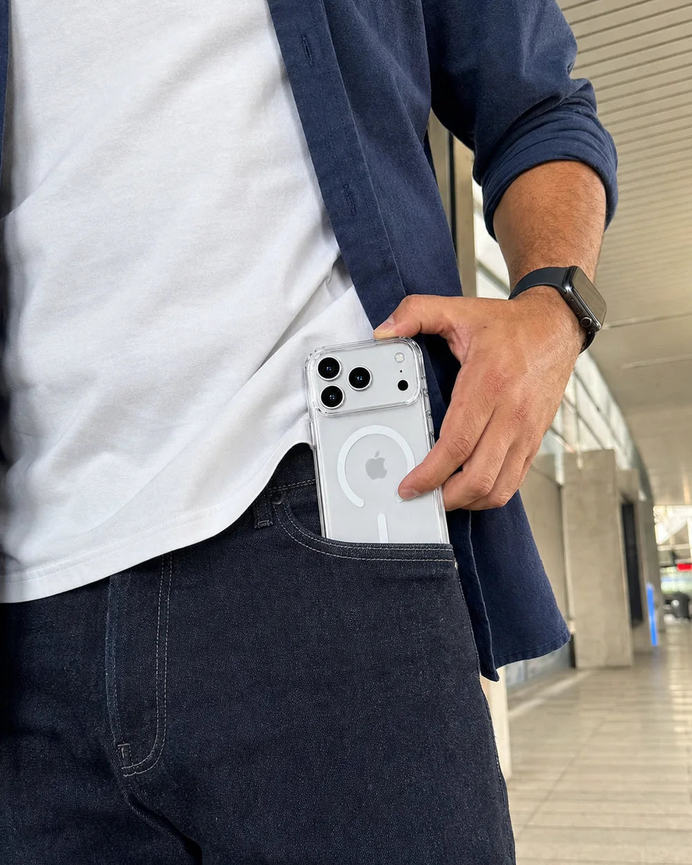 Man removing a clear CaseBear iPhone 17 Pro Max case from a denim pocket