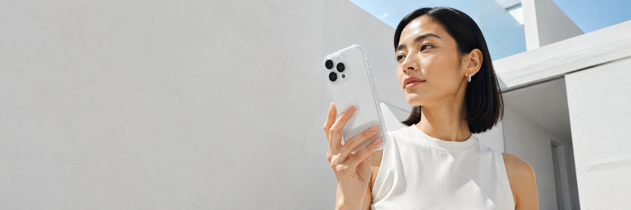 Model holding a CaseBear anti-yellow clear case