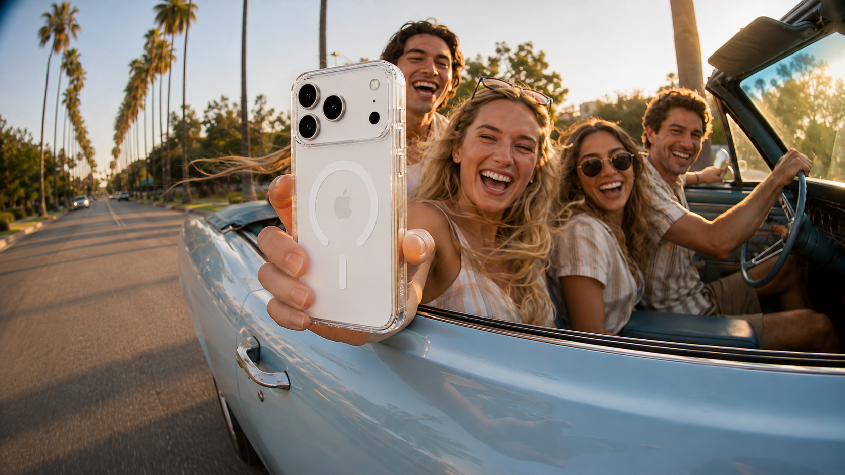 CaseBear clear iPhone 17 Pro Max case on a palm-lined sunset drive