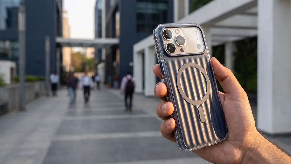 Deep-blue CaseBear Ribbed MagSafe case held securely in one hand